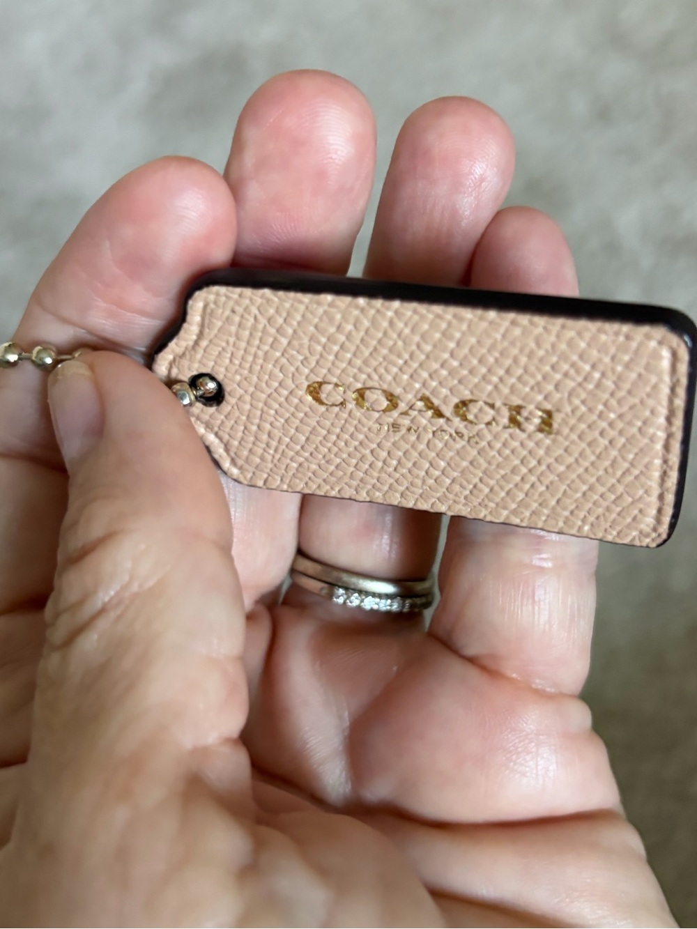Coach  Beige Leather Hangtag with Gold Logo and gold Coach Ball Chain